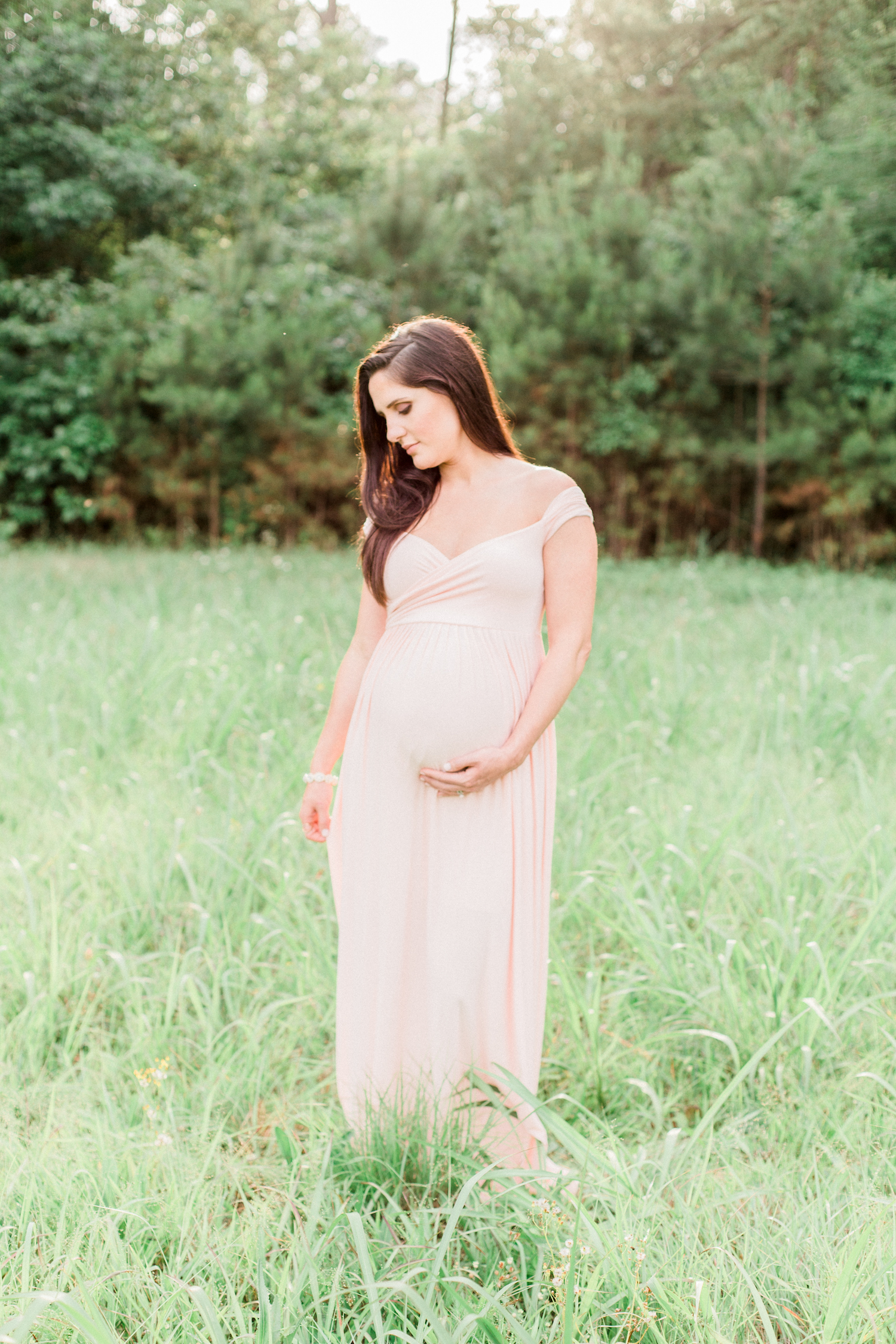 Motherhood, mom to be. Blush pink maternity dress for an Atlanta family session.