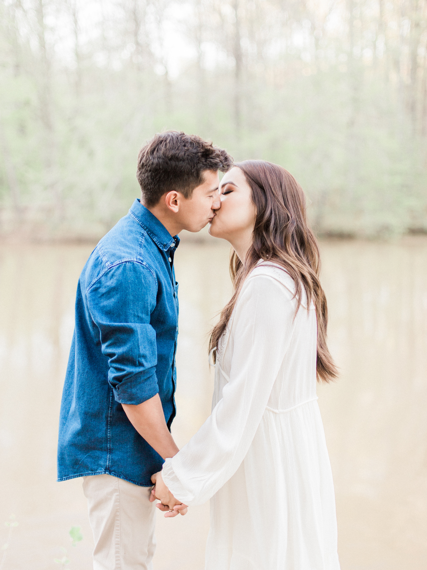 Spring engagement session at Sweetwater Creek State Park in north Georgia. Featuring white, neutral outfits and natural and organic elements. Photo by Kesia Marie Photography - fine art wedding and portrait photographer in Atlanta, Georgia.